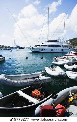 Inflatable rafts and sailboats in the sea View Large Photo Image Stock Photo - Inflatable rafts and sailboats in the sea. Fotosearch