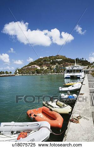 Inflatable rafts with a boat docked at a harbor View Large Photo Image Stock Photography - Inflatable rafts with a boat docked at a harbor. Fotosearch