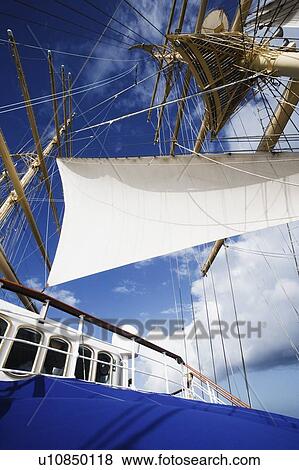 Low angle view of a sailing ship View Large Photo Image Stock Photo - Low angle view of a sailing ship. Fotosearch