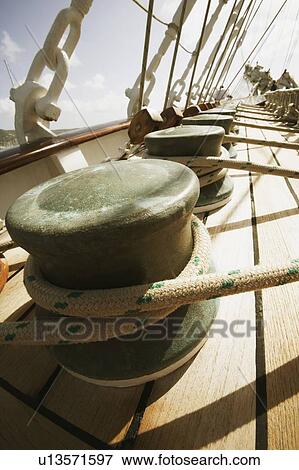 Ropes tied up with bollards in a boat View Large Photo Image Stock Photo - Ropes tied up with bollards in a boat. Fotosearch