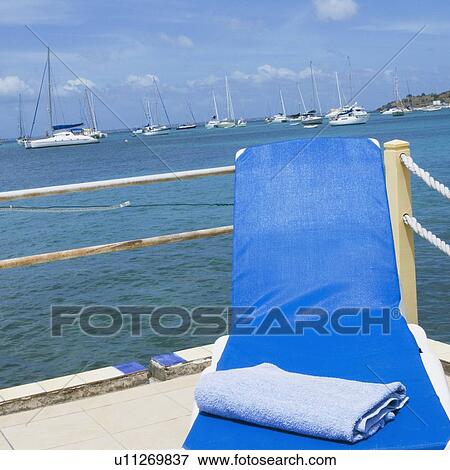 Stock Photo - Towel on a lounge chair. Fotosearch