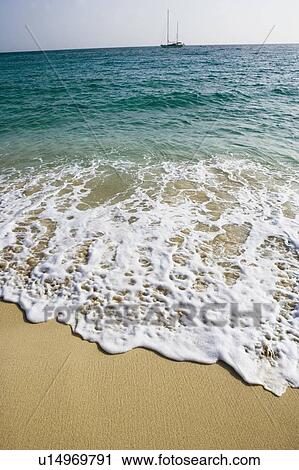 Stock Image - Waves on the beach. Fotosearch