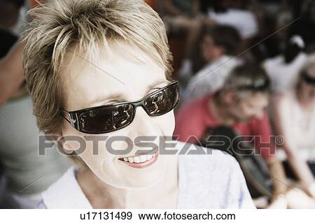 Close-up of a mature woman smiling View Large Photo Image Stock Photo - Close-up of a mature woman smiling. Fotosearch