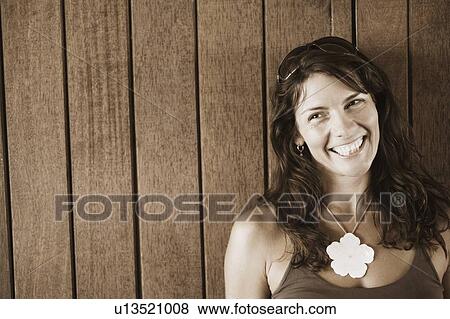 Close-up of a mid adult woman looking away View Large Photo Image Stock Photo - Close-up of a mid adult woman looking away. Fotosearch