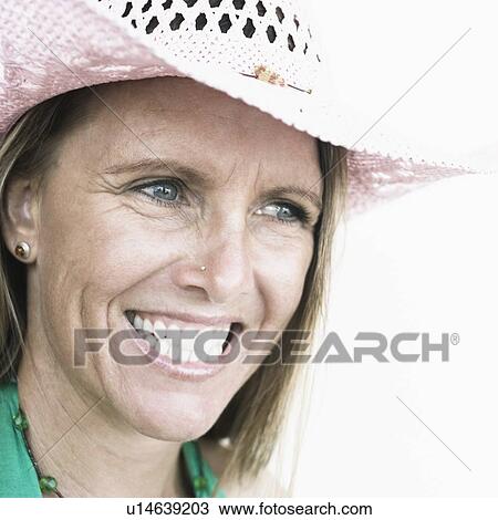 Close-up of a mid adult woman smiling View Large Photo Image Stock Image - Close-up of a mid adult woman smiling. Fotosearch