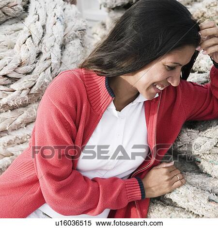 Close-up of a young woman smiling View Large Photo Image Stock Photography - Close-up of a young woman smiling. Fotosearch