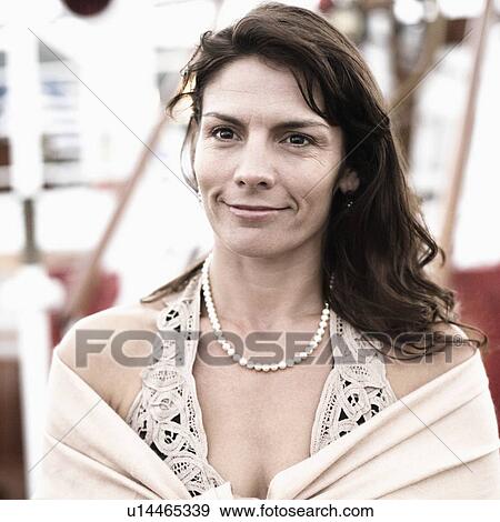 Mid adult woman smiling View Large Photo Image Stock Photo - Mid adult woman smiling. Fotosearch