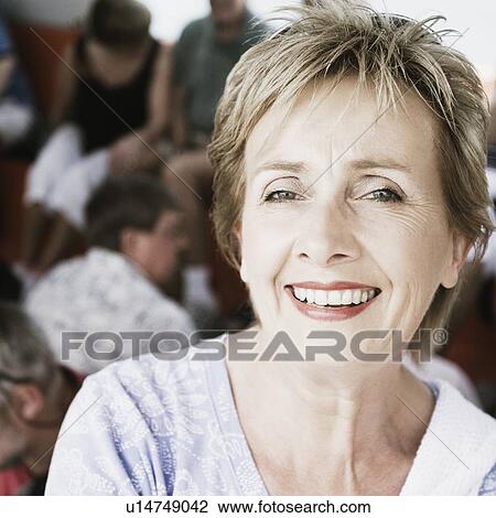 Portrait of a mature woman smiling View Large Photo Image Stock Image - Portrait of a mature woman smiling. Fotosearch