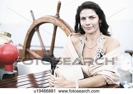 Portrait of a mid adult woman smiling View Large Photo Image Stock Image - Portrait of a mid adult woman smiling. Fotosearch