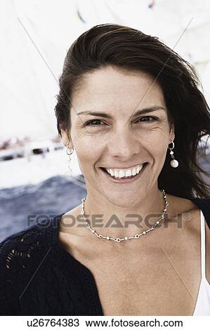 Portrait of a mid adult woman smiling View Large Photo Image Stock Image - Portrait of a mid adult woman smiling. Fotosearch