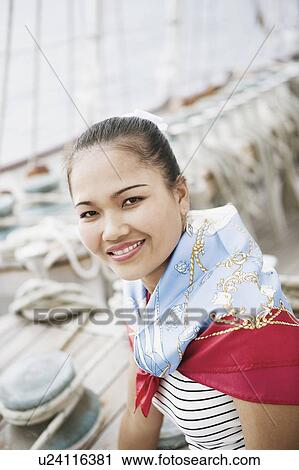 Stock Image - Portrait of a young woman smiling. Fotosearch