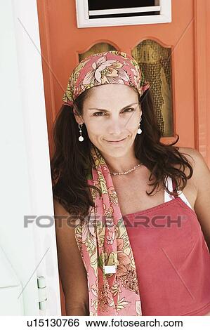 Stock Photograph - Portrait of a mid adult woman smiling. Fotosearch
