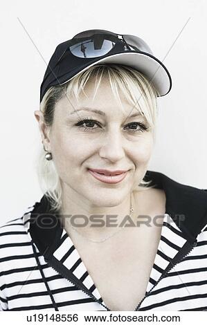 Portrait of a young woman smirking View Large Photo Image Stock Photograph - Portrait of a young woman smirking. Fotosearch