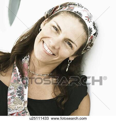 Portrait of a mid adult woman smiling View Large Photo Image Stock Image - Portrait of a mid adult woman smiling. Fotosearch