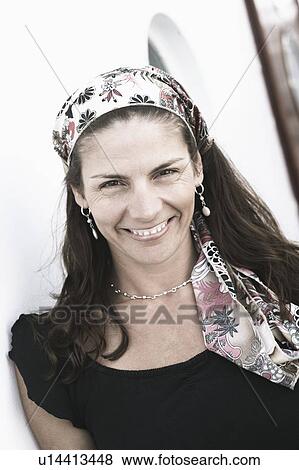 Stock Photo - Portrait of a mid adult woman smiling. Fotosearch