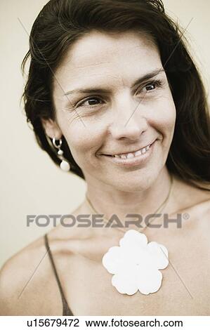 Stock Image - Close-up of a mid adult woman smiling. Fotosearch