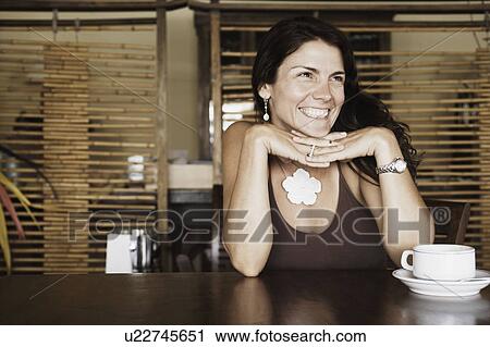 Close-up of a mid adult woman smiling View Large Photo Image Stock Image - Close-up of a mid adult woman smiling. Fotosearch