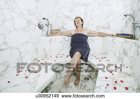 Mature woman sitting in the bathroom View Large Photo Image Stock Photo - Mature woman sitting in the bathroom. Fotosearch