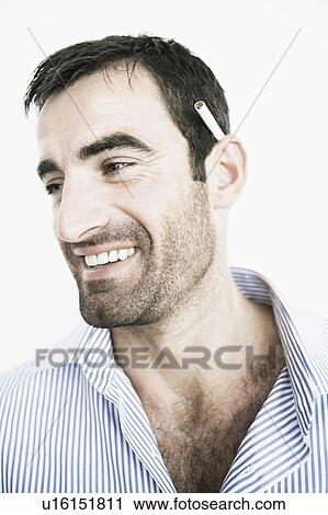 Stock Image - Close-up of a mid adult man smiling. Fotosearch