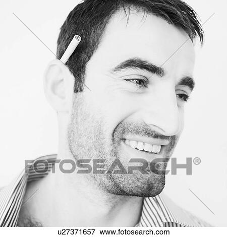 Close-up of a mid adult man smiling View Large Photo Image Stock Photo - Close-up of a mid adult man smiling. Fotosearch