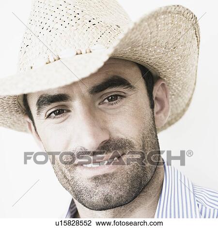 Close-up of a young man wearing a straw hat View Large Photo Image Stock Image - Close-up of a young man wearing a straw hat. Fotosearch