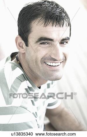 Portrait of a mid adult man smiling View Large Photo Image Stock Image - Portrait of a mid adult man smiling. Fotosearch