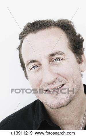 Portrait of a mid adult man smiling View Large Photo Image Stock Photo - Portrait of a mid adult man smiling. Fotosearch
