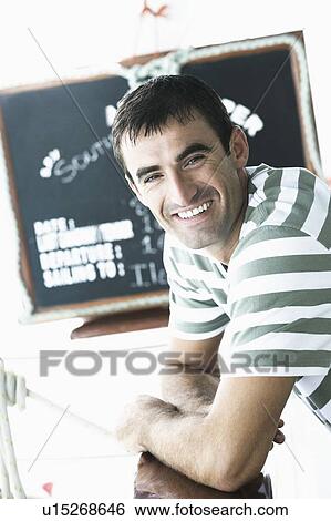 Portrait of a mid adult man smiling View Large Photo Image Stock Photograph - Portrait of a mid adult man smiling. Fotosearch