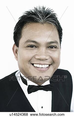 Stock Photo - Portrait of a waiter smiling. Fotosearch
