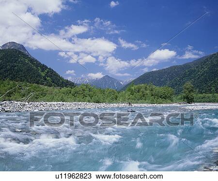 Stock Image - "River and Mountain, Nagano, Japan". Fotosearch
