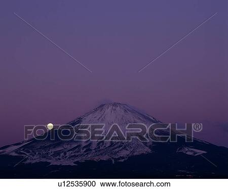 Stock Image - "Mt. Fuji And Moon In Night, Shizuoka, Japan". Fotosearch