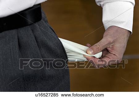 Businessman pulling out empty pocket View Large Photo Image Stock Photography - Businessman pulling out empty pocket. Fotosearch