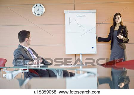 Businesswoman giving a presentation View Large Photo Image Stock Photo - Businesswoman giving a presentation. Fotosearch