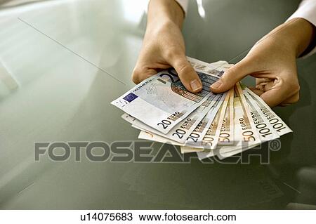 Woman's hands holding euro bills View Large Photo Image Stock Image - Woman's hands holding euro bills. Fotosearch