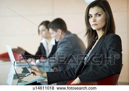 Business people at conference table View Large Photo Image Stock Photo - Business people at conference table. Fotosearch