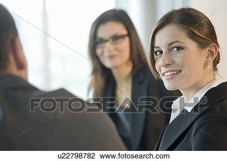 Business people discussing View Large Photo Image Stock Image - Business people discussing. Fotosearch