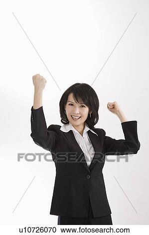 Businesswoman fists up and smiling at the camera, Business People View Large Photo Image Stock Image - Businesswoman fists up and smiling at the camera, Business People. Fotosearch