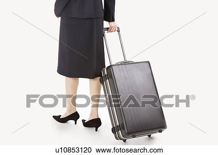 Businesswoman holding a suitcase and walking, Business People View Large Photo Image Stock Image - Businesswoman holding a suitcase and walking, Business People. Fotosearch