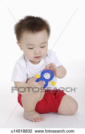 Baby boy playing with toy, Child View Large Photo Image Stock Image - Baby boy playing with toy, Child. Fotosearch