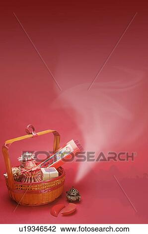 Stock Image - Incense and sacrifice in a bamboo basket and incense burner for Ching Ming Festival, CG, Chinese Culture, Backgrounds. Fotosearch