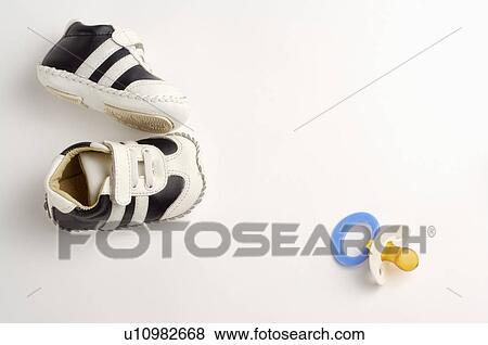 Stock Photo - Pacifier, Shoes. Fotosearch