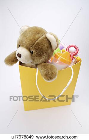 Teddy Bear in shopping bag View Large Photo Image Stock Photo - Teddy Bear in shopping bag. Fotosearch