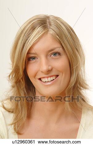 Stock Image - Portrait of woman, smiling. Fotosearch