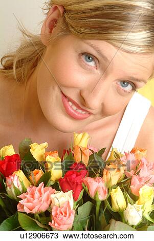 Portrait of Woman with bouquet of roses View Large Photo Image Stock Image - Portrait of Woman with bouquet of roses. Fotosearch