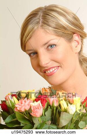 Portrait of Woman with bouquet of roses View Large Photo Image Stock Image - Portrait of Woman with bouquet of roses. Fotosearch