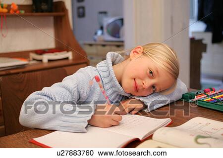 School girl doing homework exercises View Large Photo Image Stock Image - School girl doing homework exercises. Fotosearch