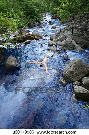 Stock Photograph - A body in a stream. Fotosearch