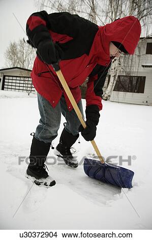 A man shoveling snow View Large Photo Image Picture - A man shoveling snow. Fotosearch