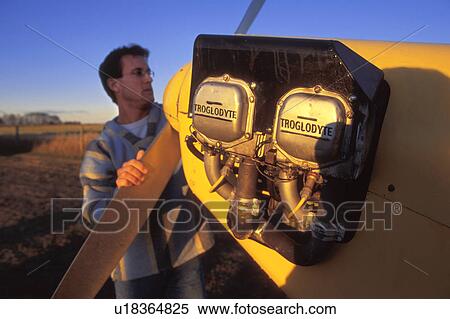 A pilot with his airplane View Large Photo Image Stock Photography - A pilot with his airplane. Fotosearch