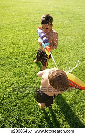 Stock Photo - A water fight. Fotosearch